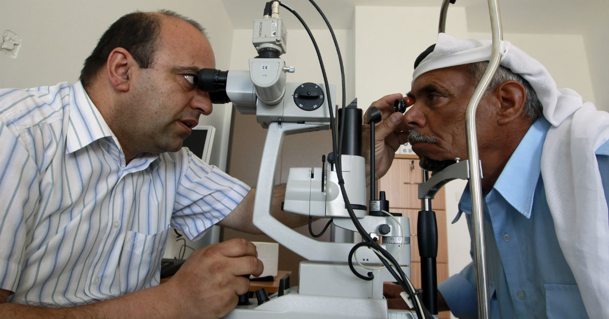 A Palestinian doctor examines a patient’s eyes at a medical center in a refugee camp in the West Bank town of Bethlehem, on May 7, 2012. Ammar Awad/Reuters